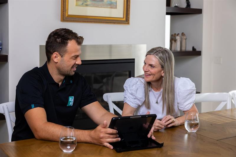 Plumber giving an upfront quote to a customer